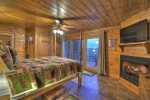 Bedroom in the Finished Basement with a Queen Bed, Gas-Log Fireplace and Flat Screen TV